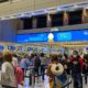 An airport gate in Orlando-Travelers Not Wearing Masks Could Receive a $1,500 Fine-ss-Featured
