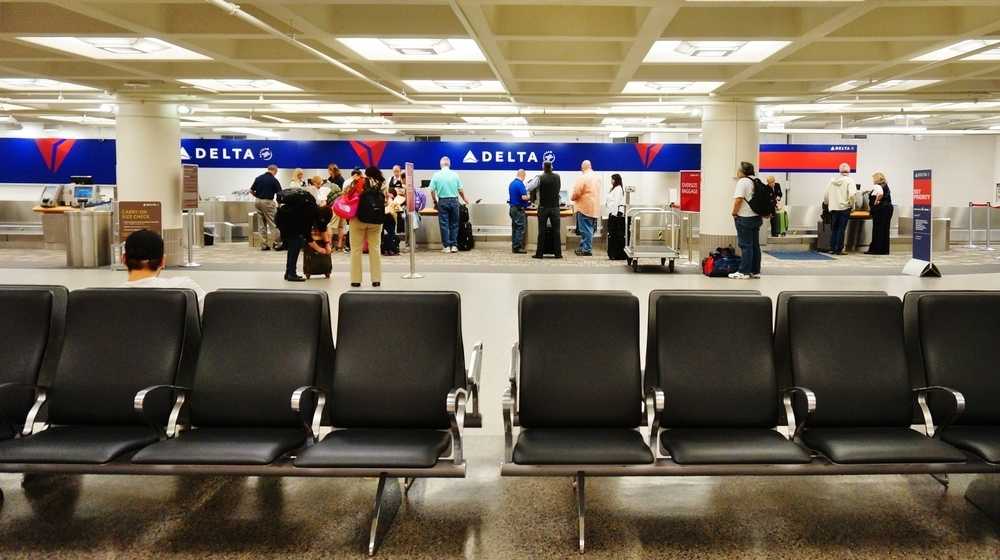Delta counters at the Minneapolis-St Paul International Airport-Delta CEO Says Requiring Negative COVID-19 Test Is a 'Horrible Idea'-ss-Featured