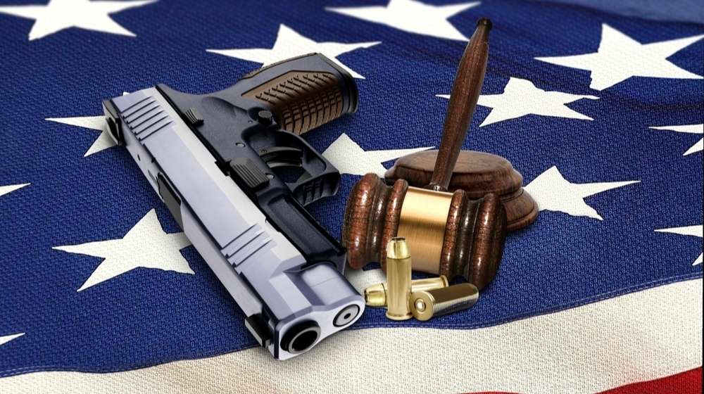 Gun, bullets and a gavel on an American flag- Oregon - ss-Featured