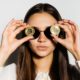 serious girl with black glasses put a coin to her eyes.bitcoins-Bitcoin Is Extremely Inefficient-ss-featured