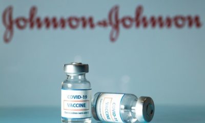 Concept of COVID vaccine vials with J&J logo in the background-Biden to Purchase 100 Million Johnson & Johnson COVID Vaccine Doses-ss-Featured