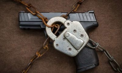 Gun Control concept art with gun under chain and lock-Feinstein and Cicilline Introduces Gun Ban Bill In Senate-ss-Featured