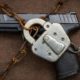 Gun Control concept art with gun under chain and lock-Feinstein and Cicilline Introduces Gun Ban Bill In Senate-ss-Featured