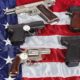 National firearms act - Pistols and revolver assorted firearms for sale on USA America flag at gun show-US Gun Sales-ss-featured