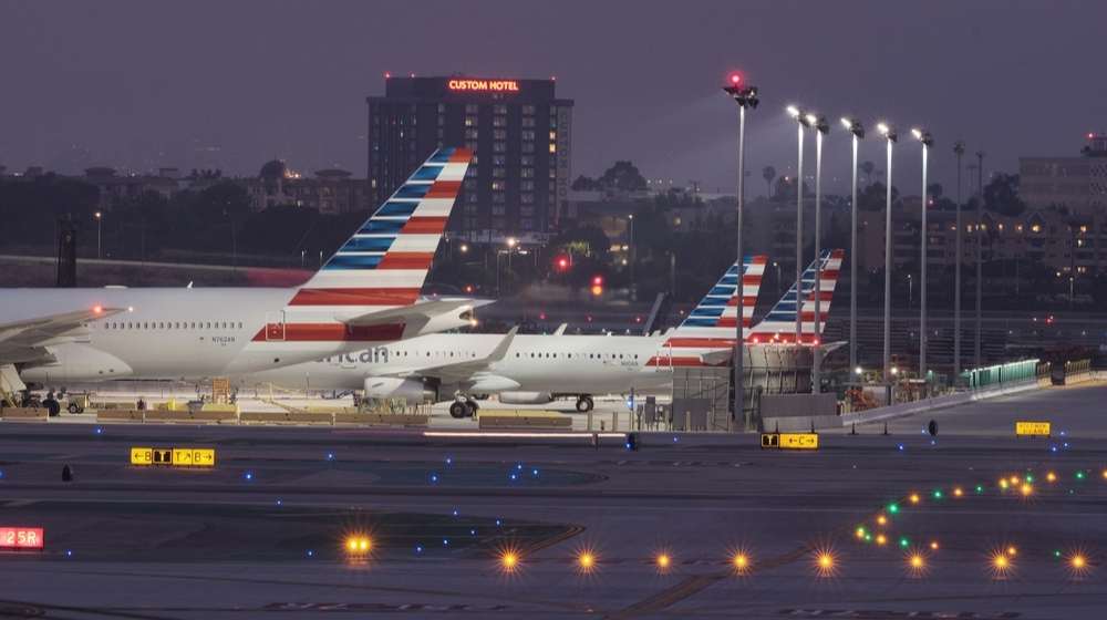 Planes at an airport-No Mandatory Quarantine for Out of State Travel Starts April 1st in New York-ss-Featured