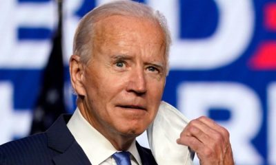 President Joe Biden removing his face mask for a speech-Biden's Mandatory Face Mask Push Misses Deadline -ss-Featured