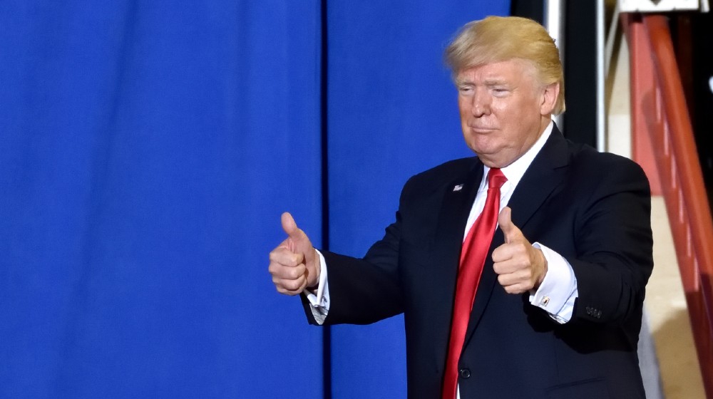 President Trump giving a two thumbs up gesture as he exits the stage of his campaign rally-Get A COVID-19 Vaccine-ss-featured