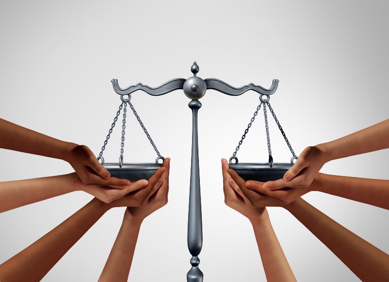 Social justice and equality law in society as diverse people holding the balance in a legal scale | 5 Ways To Ensure Fairness, To Accuser And Accused!