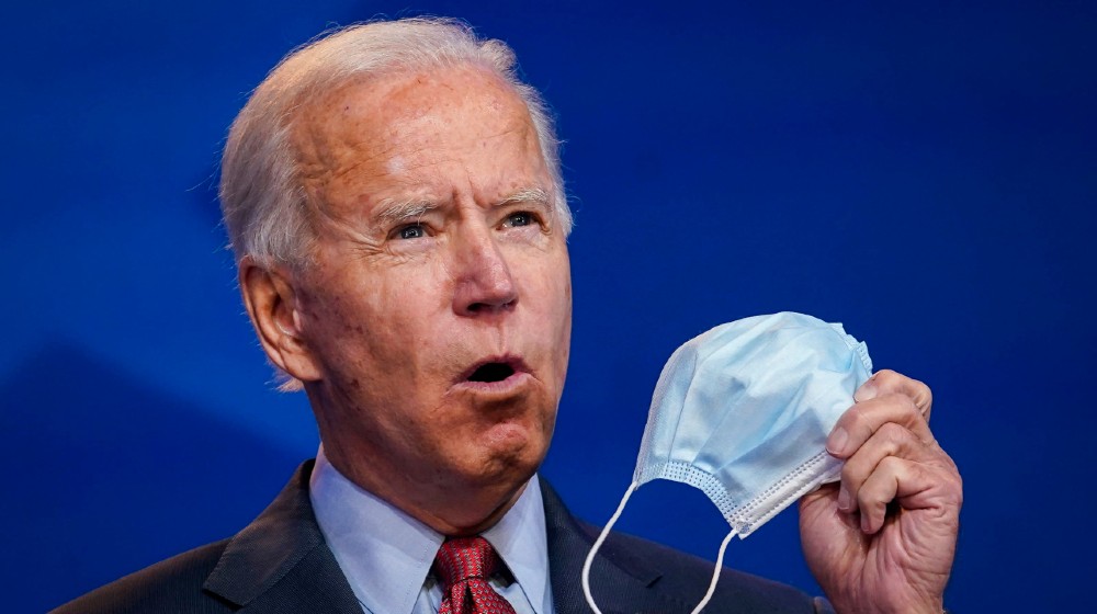 USADemocratic prssident-elect Joe Biden holds up a face mask while giving remarks about the Affordable Care Act and Covid-19 at the Queen theater-Neanderthal Thinking-ss-featured