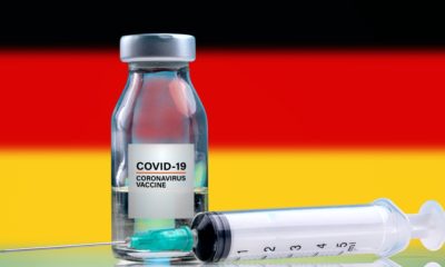 Vaccine and syringe injection, Germany Flag background-German-SS-Featured