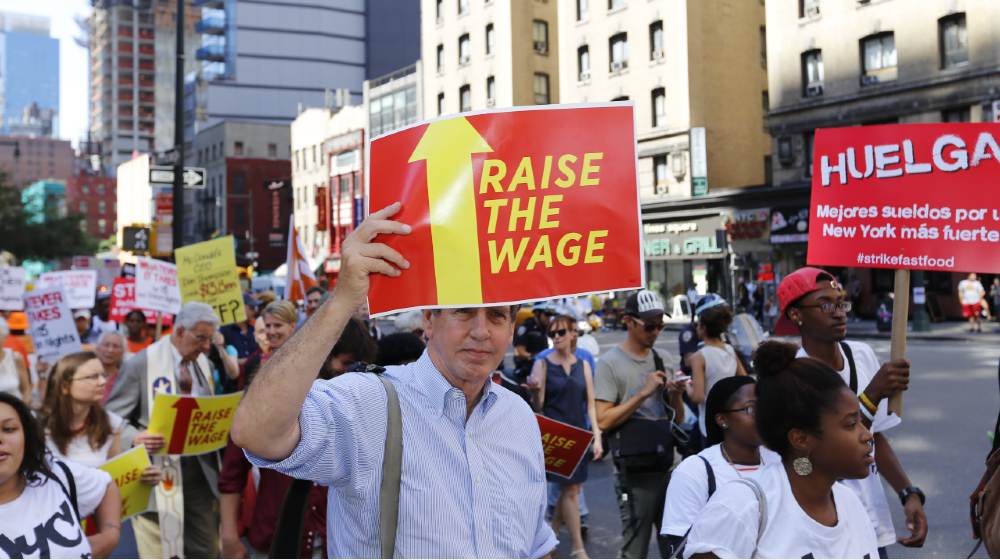 fast food workers and their supporters marched along 8th Ave calling for an increase in the minimum wage-minimum wage bump-ss-featured