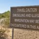 A warning sign in the Arizona desert-Biden Border Crisis Continues 80 Migrant Minors Crossing Arizona Desert-ss-featured