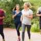 Four people running outdoors-CDC Guidelines Say Fully Vaccinated Americans can Ditch the Mask Except in Crowded Areas-ss-Featured