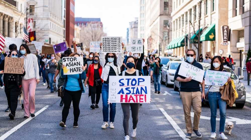 People rallying with Stop Asian Hate signs-Chinese State Media is Group Behind 'Stop AAPI Hate' Movement-ss-Featured