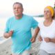 Senior couple jogging on the coast | Regular Exercise Helps COVID-19 Patients Avoid Hospitals | Featured