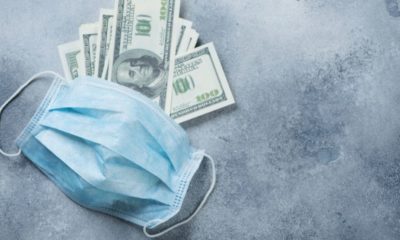 money and a facemask-USA Spends TRILLIONS to Cure Common Flu-ss-Featured