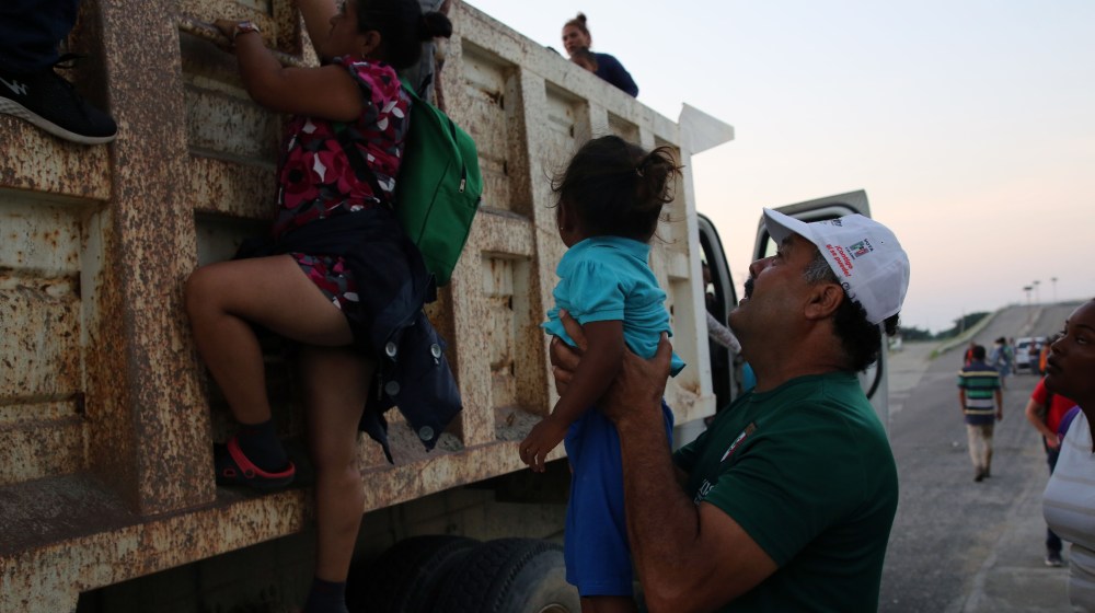 A Honduran man fleeing poverty and gang violence in the second caravan to the U.S.-Migrant Kids-SS-Featured