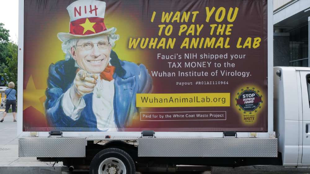 A truck feature a likeness of Dr. Anthony Fauci as Uncle Sam and questioning his supposed expenditures through the NIH | Fauci Should Resign Now For His COVID-19 Blunders | Featured