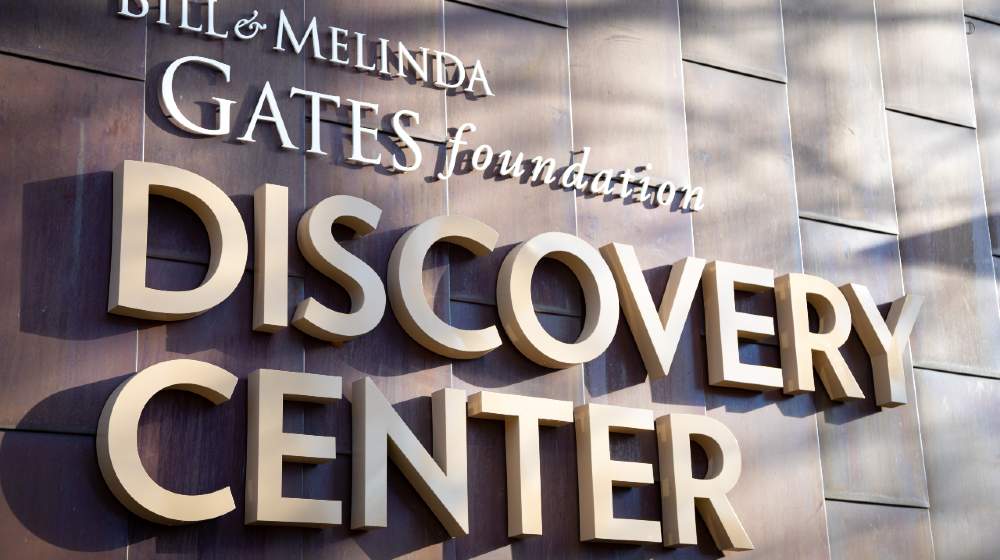 Bill and Melinda Gates Foundation Discovery Center sign on the exterior of the philanthropic headquarters building in Seattle | Melinda Gates Is Now A Billionaire After Her Divorce | Featured