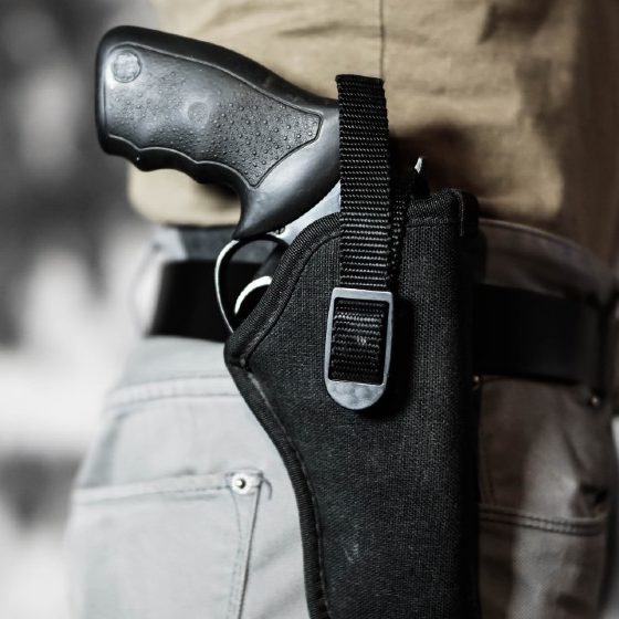 Nebraska - Man openly carrying a revolver in a holster on his belt. Open carry and second amendment concept | Texas Senate Approves Constitutional Carry for Handguns | Featured