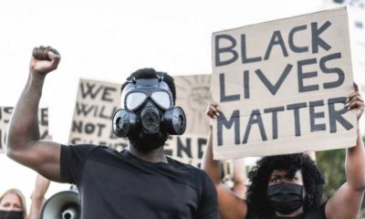 Protesters holding a black lives matter sign-Ridculous Demands From BLM Calls For Trump Conviction -ss-Featured