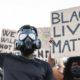 Protesters holding a black lives matter sign-Ridculous Demands From BLM Calls For Trump Conviction -ss-Featured