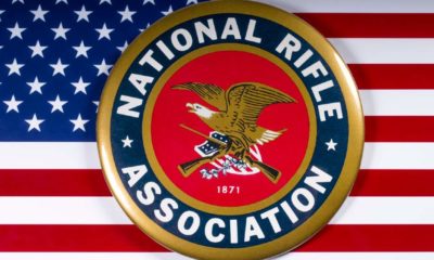 The symbol of the National Rifle Association portrayed with the US flag, on 26th March 2018 | Federal Judge Dismisses NRA Bankruptcy Claim | Featured