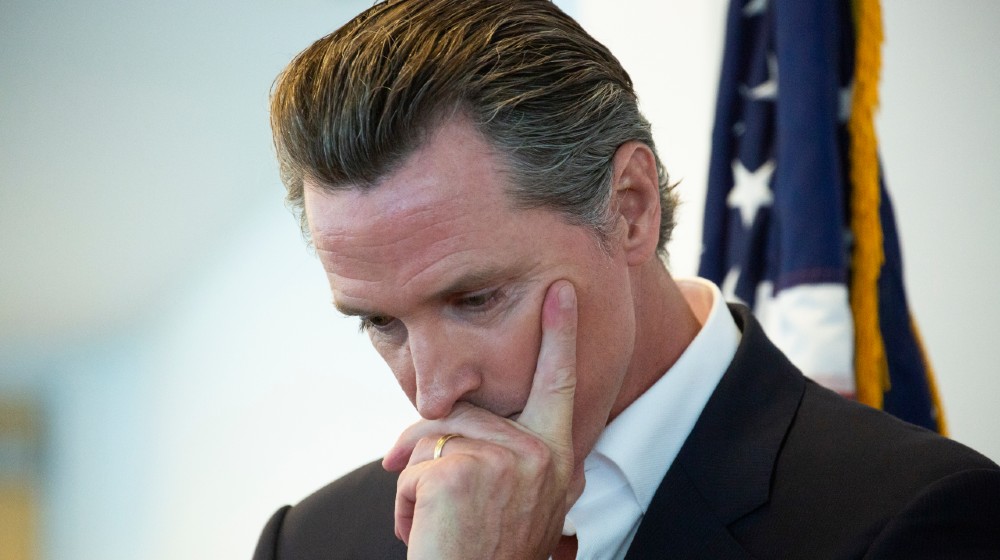 California State Governor Gavin Newsom holds his head in though before a meeting | It’s Official: California Recalls Gov. Gavin Newsom | featured