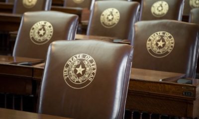 Rows of leather seats, with gold embossed The State of Texas and Lone Star seal | Abbott Defunds Texas Legislature As Dems Walk Out | featured