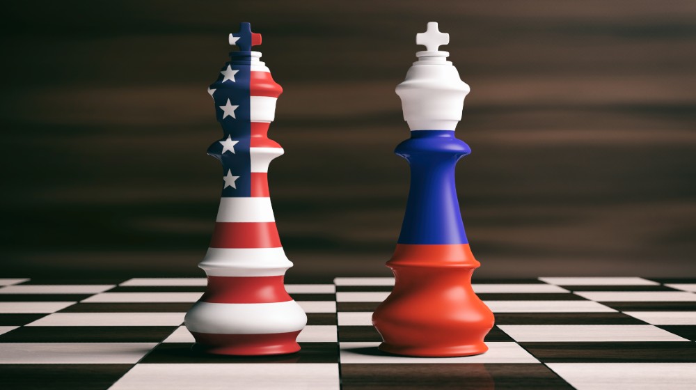 USA and Russia relations, cooperation strategy. US America and Russia flags on chess kings on a chess board | Russia Removes US Dollar Assets From Its Wealth Fund | featured