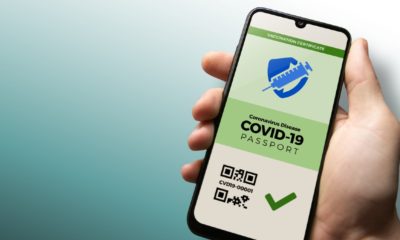 Vaccination passport for COVID-19 displayed on smartphone held in male's | Bill To Prohibit TSA From Requiring Vaccine Passports | Featured