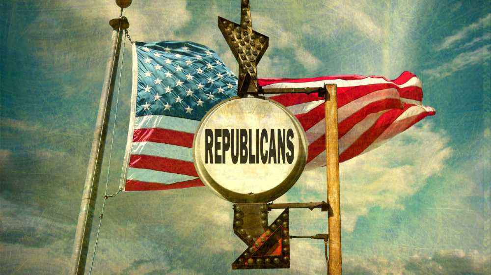 aged and worn vintage photo of republicans sign with american flag | GOP Shoots Down Electoral Reform Bill Even As Dems Unite | featured