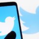 Twitter logo is displayed on a mobile phone and a monitor screen | Taylor-Greene Hit With Another Twitter Suspension | featured