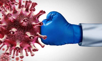 Virus vaccine and flu or coronavirus medical fight disease control as a doctor fighting a group of contagious pathogen cells | Politicising Covid-19 fight is perilous | featured