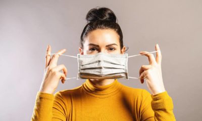 Woman wearing an anti virus protection mask to prevent others from corona COVID-19 | If You Aren't Vaccinated, Wear A Mask Instead Of Risking Infection! | featured