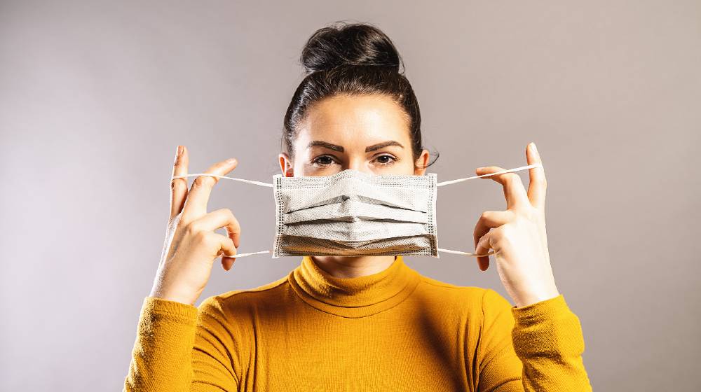 Woman wearing an anti virus protection mask to prevent others from corona COVID-19 | If You Aren't Vaccinated, Wear A Mask Instead Of Risking Infection! | featured