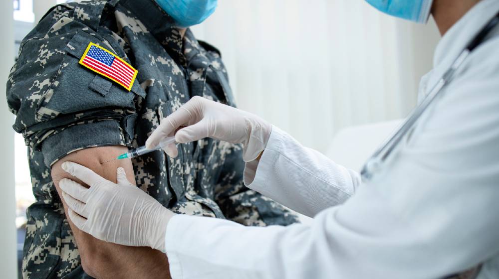 American soldier getting vaccine shot during corona virus pandemic