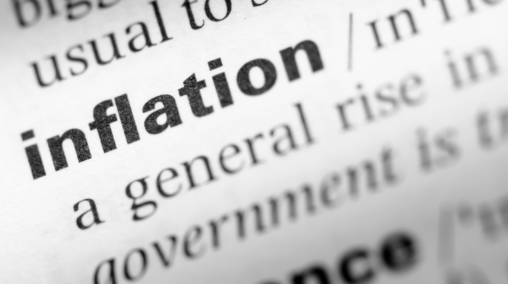 Close up of English dictionary page with word inflation | Inflation: Causes, Perceptions, Concerns, Strategies, Actions! | featured