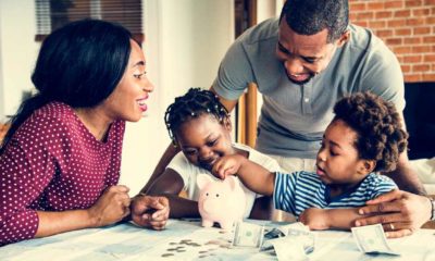 Family saving money to piggy bank | Top 5 Ideas to Save Money at Home | featured