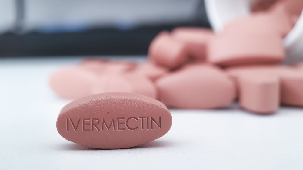 Ivermectin red pill medication on white table medical concept of International nonproprietary name for coronavirus and antiparasitic drug | CDC: Stop Using Ivermectin Instead Of Getting Vaccinated | featured