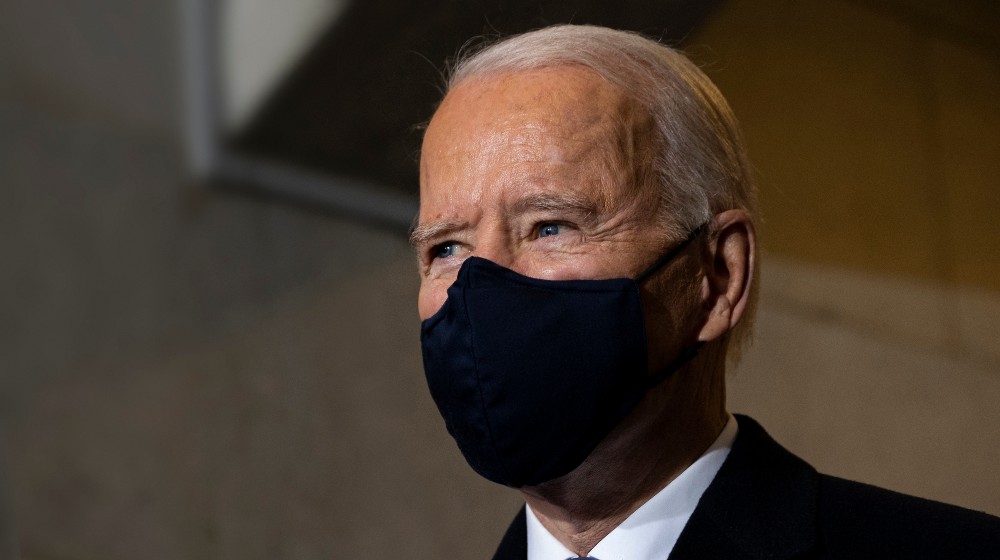 President of the United States, Joe Biden wearing a mask | Biden Calls On More Companies To Issue Vaccine Mandates | featured