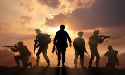 Six military silhouettes on sunset sky background | Biden Vows US Retaliation For Kabul Terrorist Attack | featured