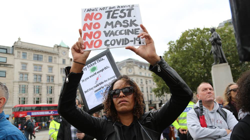 Anti-mask, anti-lockdown and anti-vaccine protesters stage a demonstration in Trafalgar Square | YouTube Bans Anti-Vaxxers, ‘Misleading’ Vaccine Videos | featured
