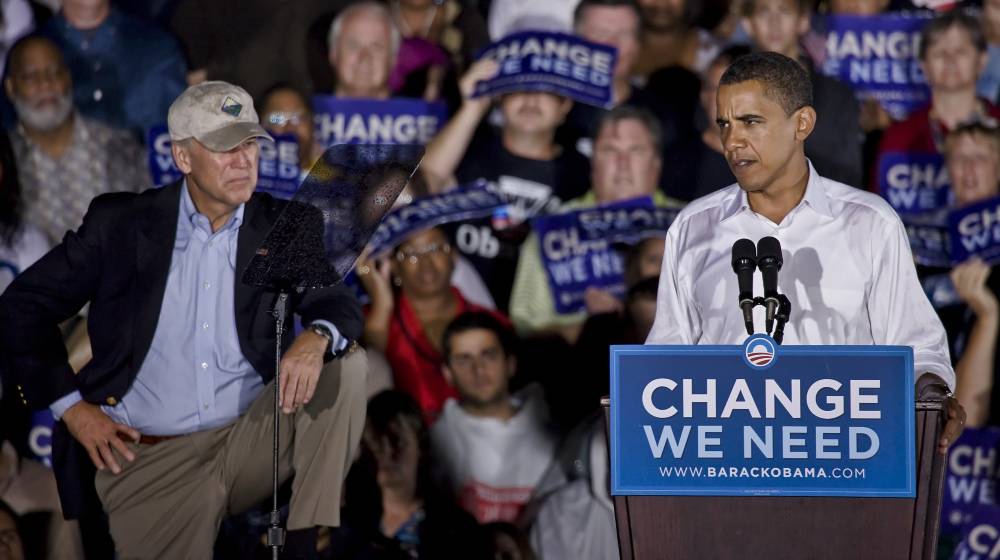 Democratic presidential candidate Barack Obama (R) speaks to supporters while VP candidate Biden looks on at a rally | Obama Contradicts Biden: Open Borders Are Unsustainable | featured