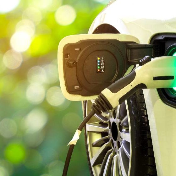 EV Car or Electric car at charging station with the power cable supply plugged in | Electric Vehicles Pose Risks for Emergency Responders | featured