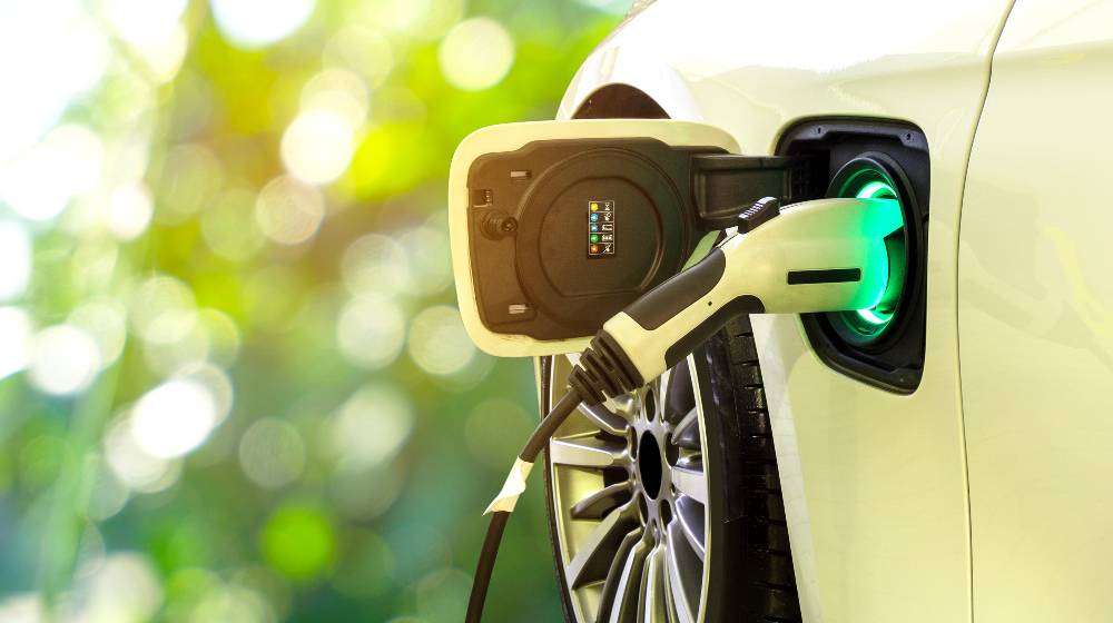 EV Car or Electric car at charging station with the power cable supply plugged in | Electric Vehicles Pose Risks for Emergency Responders | featured