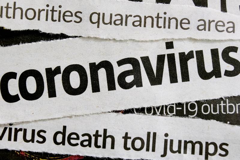 Novel coronavirus breaking news headline clippings from various newspapers reporting on the deadly disease-CNN 5 Things