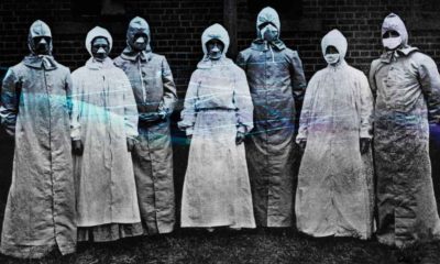 People in protective suits from the Spanish flu epidemic coronavirus contaminated background | COVID-19 Killed The Same Number of Americans As Spanish Flu | featured
