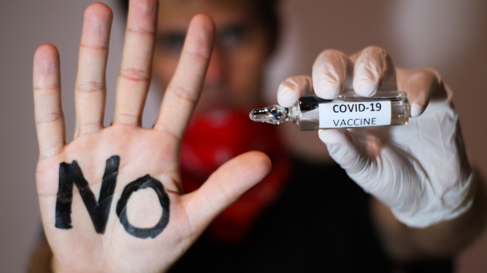 A anti vax or anti vaccine protests against the new covid-19 vaccine | College Students Prefer Dropping Out Rather Than Getting Vaccine | featured