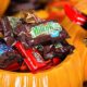 Decorative pumpkins filled with assorted Halloween chocolate candy made by Mars | Do US Troops Enjoy Getting Leftover Halloween Candy? | featured